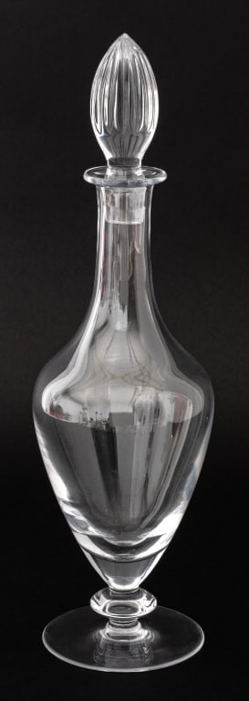Christofle Crystal Bottle Decanter: Christofle Crystal Bottle Decanter, with fluted stopper and raised above a circular foot, marked "Christofle" with "Made in Slovenia" label to underside. 15.25" H x 4.25" Diameter. Provenance: From a