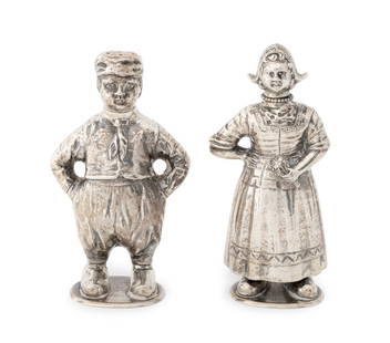 Dutch Sterling Figural Salt & Pepper Shakers, Pair: Pair of Dutch Sterling Silver Figural Salt and Pepper Shakers, late 19th century, comprising: gentleman wearing a hat with his hands in his pockets and a woman wearing a traditional Dutch dress, both