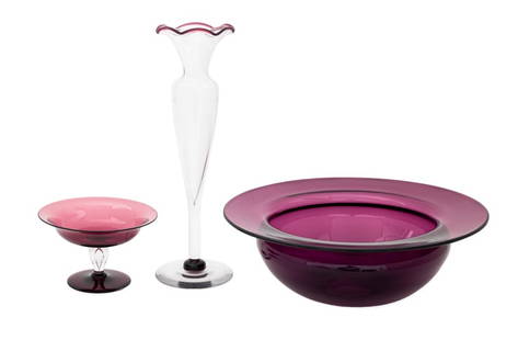 Amethyst Art Glass Tableware Articles, 3: Set of Three Amethyst Art Glass Tableware Articles, one stem compote with flared lip, one centerpiece bowl with flared lip, and one clear glass vase with amethyst colored rim, each apparently unmarked