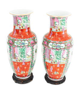 Chinese Rose Medallion Porcelain Vases, Pair: Pair of Chinese Rose Medallion Porcelain Vases, painted in the traditional manner with panels depicting court scenes and fruit trees with pheasants, on carved openwork stands. 19.5" H x 8" Diameter. P