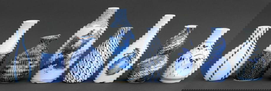 Japanese Blue & White Porcelain Bottle Vases, 8: Group of Eight Japanese Blue and White Porcelain Bottle Vases, seven marked to undersides, including: one with hand-painted figural scene, a double gourd vase, and one with a fishnet design. Tallest: