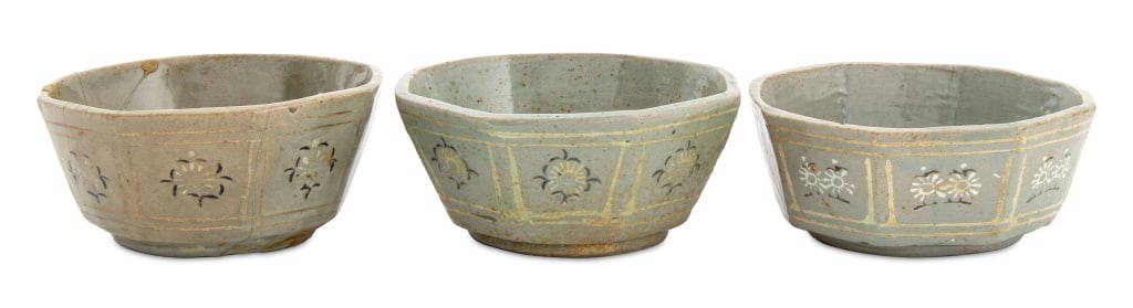 Korean Celadon Glazed Octagonal Pottery Bowls, 3: Set of Three Korean Celadon Green Glazed Octagonal Pottery Bowls, with white flower decoration. Each: 2" H x 4.5" Diameter. Provenance: From a New York City Collection. Keywords: Ceramics, Asian Art,