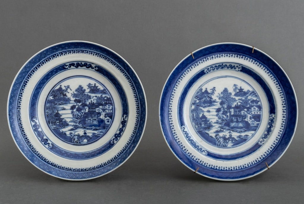 Chinese Blue and White Nanking Porcelain Plates, 2: Pair of Chinese Blue and White Nanking Porcelain Plates, each depicting houses and gardens along a river. 1.5" H x 9.75" Diameter. Provenance: From a Central Park West Estate. Keywords: Asian Art, Chi
