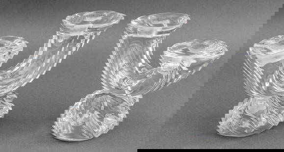 Daum Two-Branch Glass Candlesticks, Pair: Pair of Daum Two-Branch Colorless Glass Candlesticks, each marked "Daum France" near base. 6" H x 7.25" W x 3.5" D. Provenance: From a Fifth Avenue Collection. Keywords: French Crystal, Art Glass, Cle