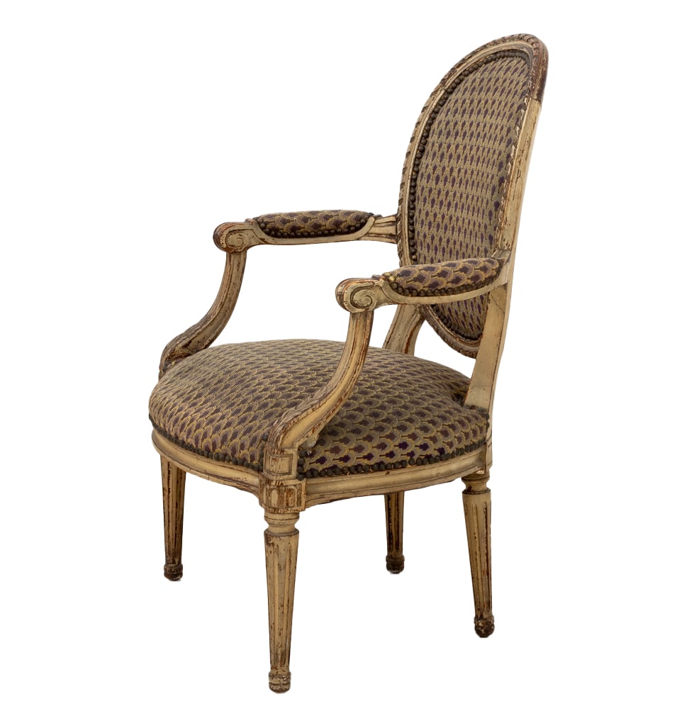 Louis XVI Style White Painted Fauteuil, 19th C.: Louis XVI Style White Painted Fauteuil, 19th century, with oval backrest and floral tapestry upholstery back and seat, on carved and fluted tapered legs. 36" H x 23.75" W x 21" D; seat: 16.5" H. Prove