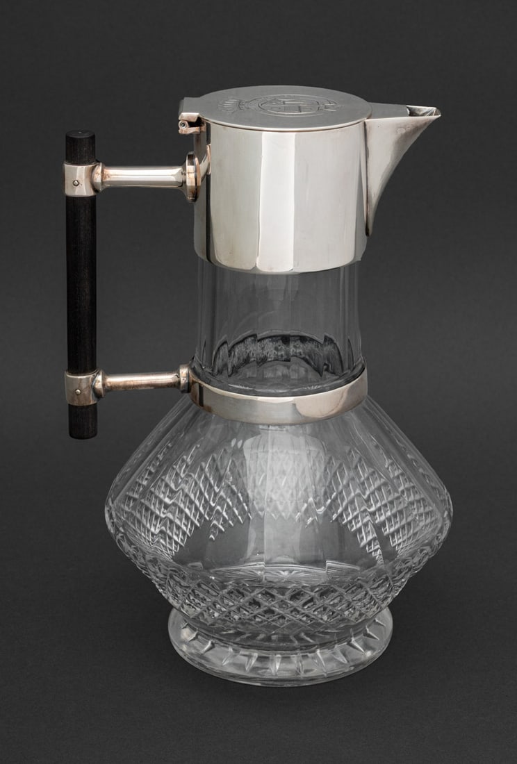 Christopher Dresser Glass Claret Jug, 1881: Dr. Christopher Dresser for Hukin and Heath Silver Plate Mounted Glass Claret Jug, struck with marks for May 1881, with engraved coat of arms of the Erlanger Family of bankers and motto "Rast Ich so R