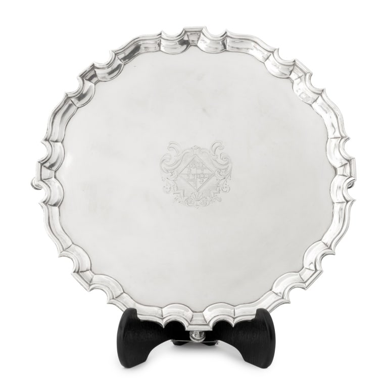 George II Sterling Silver Salver Tray, 1738: George II Sterling Silver Salver Tray, struck with marks for John Robinson II, London, 1738, with shaped rim and armorial crest on four hoof feet, initialed "D * C" and marked to the underside. Weight