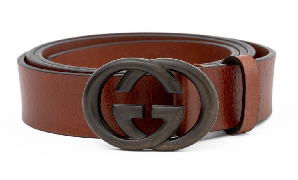 Gucci Brown Brass Buckle & Brown Leather Belt: Gucci Patinated Brass Buckle Brown Leather Belt, marked "GUCCI / made in Italy / 170855 - 492949 - 110-44" to reverse. 47" L x 1.25" W. Provenance: From a New York City Collection. Keywords; Fashion,