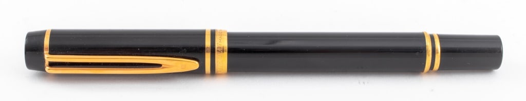Waterman Black Resin 18K Gold Nib Fountain Pen: Waterman Black Resin Body and 18K Yellow Gold Nib Fountain Pen with, marked "WATERMAN / MADE IN FRANCE" to cap, "WAT / SA" to clip, "WATERMAN / IDEAL / PARIS / 18K 750 / FRANCE" to nib. 5.75" L. Prove
