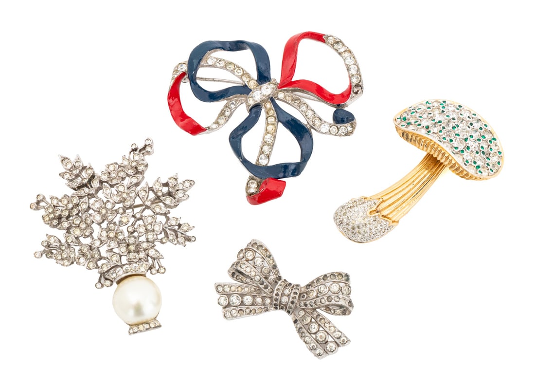 Costume Jewelry Brooches, 4: Collection of Four Costume Jewelry Brooches, comprising: Nettie Rosenstein gold-tone mushroom with clear and green rhinestones, marked "Nettie Rosenstein" to the reverse, Trifari silver-tone bow form