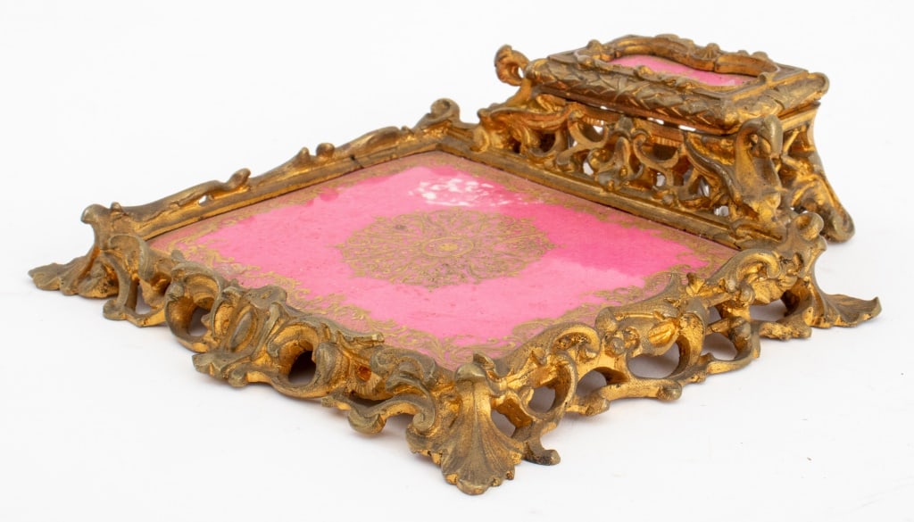Rococo Style Porcelain & Gilt Bronze Inkwell: Rococo Style Porcelain and Gilt Bronze Inkwell, enhanced with pink porcelain plates in the manner of Sevres. 1.75" H x 5.75" W x 6.25" D. Provenance: From a New York City Collection. Keywords: Writing