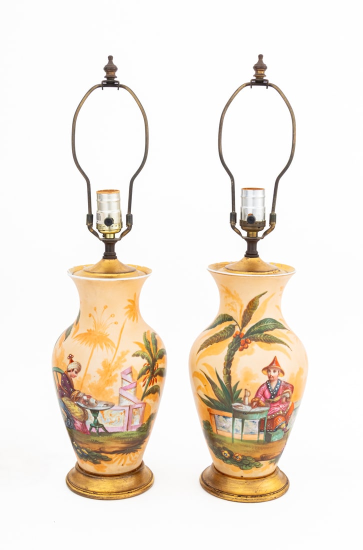 Chinoiserie Porcelain Vases as Lamps, Pair: Pair of French Chinoiserie Porcelain Vases Mounted as Lamps, with hand-painted seated figures in courtyard scene and floral design mounted on circular giltwood bases. Overall: 22.5" H x 6.5" Diameter.