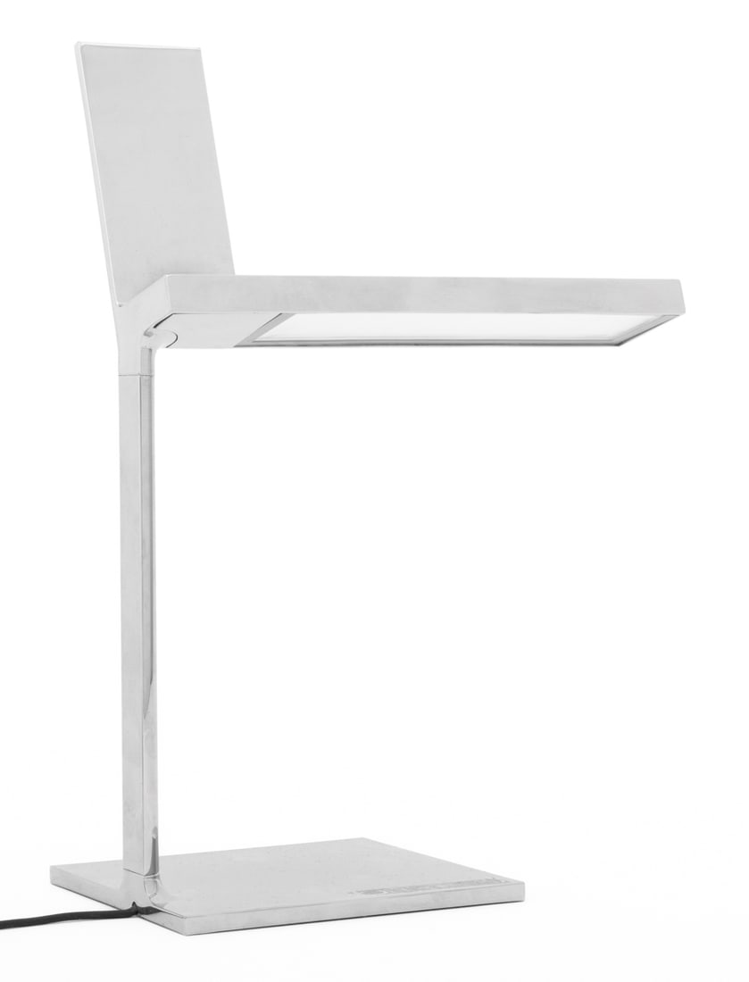 Philippe Starck x Flos d'E Light Chrome Table Lamp: Philippe Starck for Flos d'E Light Chrome Plated Table Lamp, with iPhone charger atop and label to underside. 12.25" H x 8.5" W x 4.75" D. Provenance: From the Park Avenue Estate of Designer Neal Smal