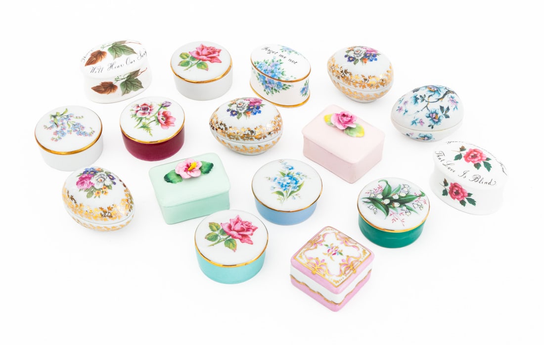French & English Porcelain Covered Boxes, 16: Collection of 16 French and English Floral Motif Painted Porcelain Covered Boxes, most marked "Limoges / France", two "Royal Adderley / Floral / Bone China / Made in England", and one "Porcelaine / de