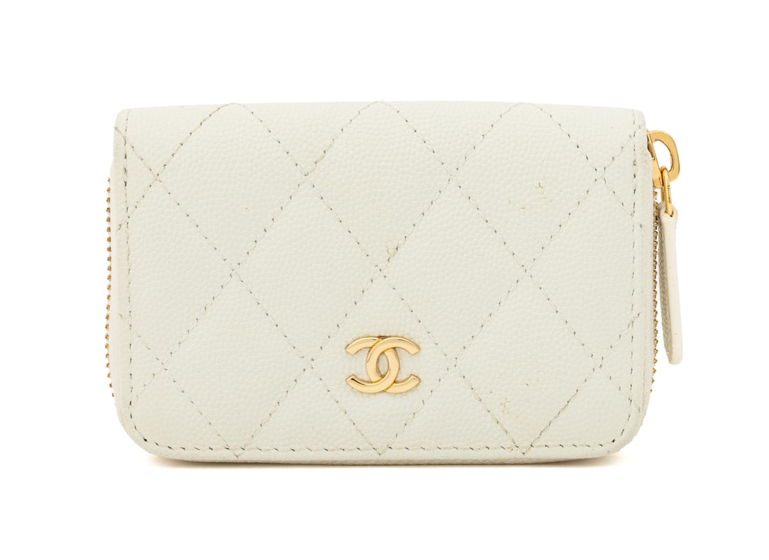 Chanel Quilted White Leather Coin Purse: Chanel Quilted White Leather Coin Purse, with gold-tone metal zipper and interlocking "CC" logo to the front, opening to three compartment divided interior, marked "Chanel / Made in Italy" inside. 3.2