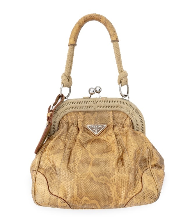 Prada Gold-Tone Snakeskin Handbag: Prada Metallic Gold-Tone Snakeskin Handbag, with luggage tag, top handle, clasp closure, and "Prada / Made in Italy" label inside. 13.5" H x 10.5" W x 6.5" D. Provenance: From a New York City Collecti