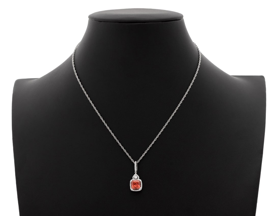 18K Gold Spinel Diamond Pendant, 14K Necklace: 18K White Gold Spinel Diamond Pendant on 14K White Gold Necklace, featuring one prong set cushion brilliant cut spinel weighing approx. 2.20 carats, further adorned with 55 prong set round brilliant c