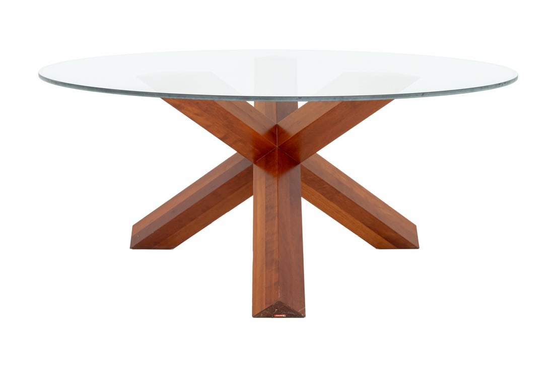Mario Bellini Cassina "La Rotonda" Dining Table: Mario Bellini for Cassina "La Rotonda" Dining Table, originally designed 1977, circular glass top over walnut wood base with label to foot. 28" H x 65" Diameter. Provenance: From a Vintage Collection