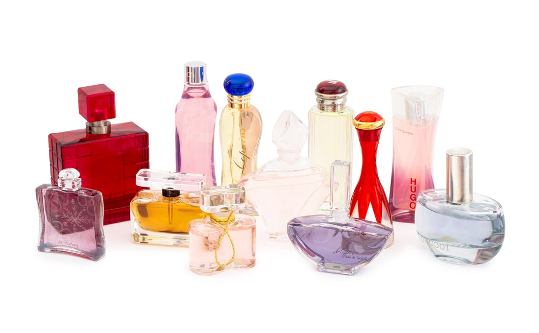 Collection of Factice Perfume Bottles, 12: Collection of Twelve Factice Perfume Bottles, comprising: Hugo Boss Pure Purple, Gres Cabaret, Estee Lauder White Linen, Oscar de la Renta Ruffles, Lancome Paris Connexion, Chopard Madness, Les Copain