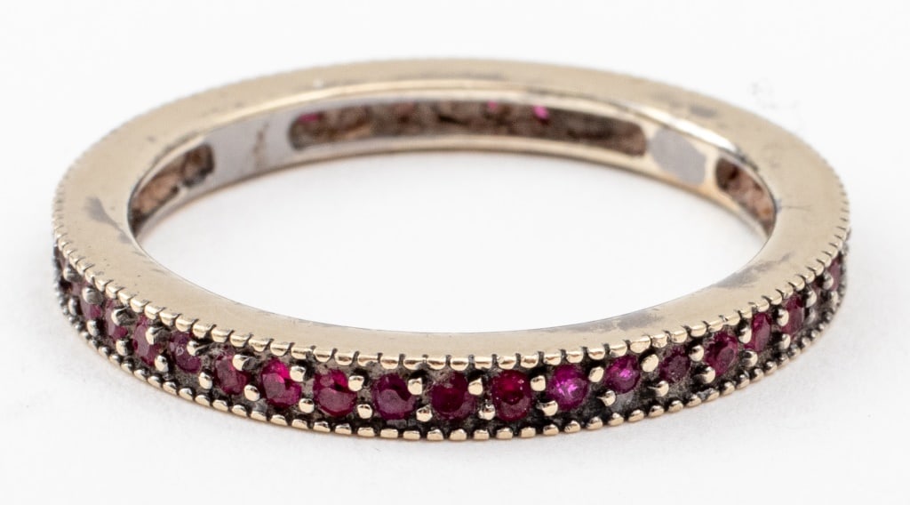 14K White Gold Red Spinel Eternity Ring Band: 14K White Gold Red Spinel Eternity Ring Band, with approx. 45 small round-cut faceted red spinel gemstones, marked: "14K". Ring: 0.875" L x 0.125" W. Ring size: 7. Approx: 1.6 dwt. inclusive. Provenan