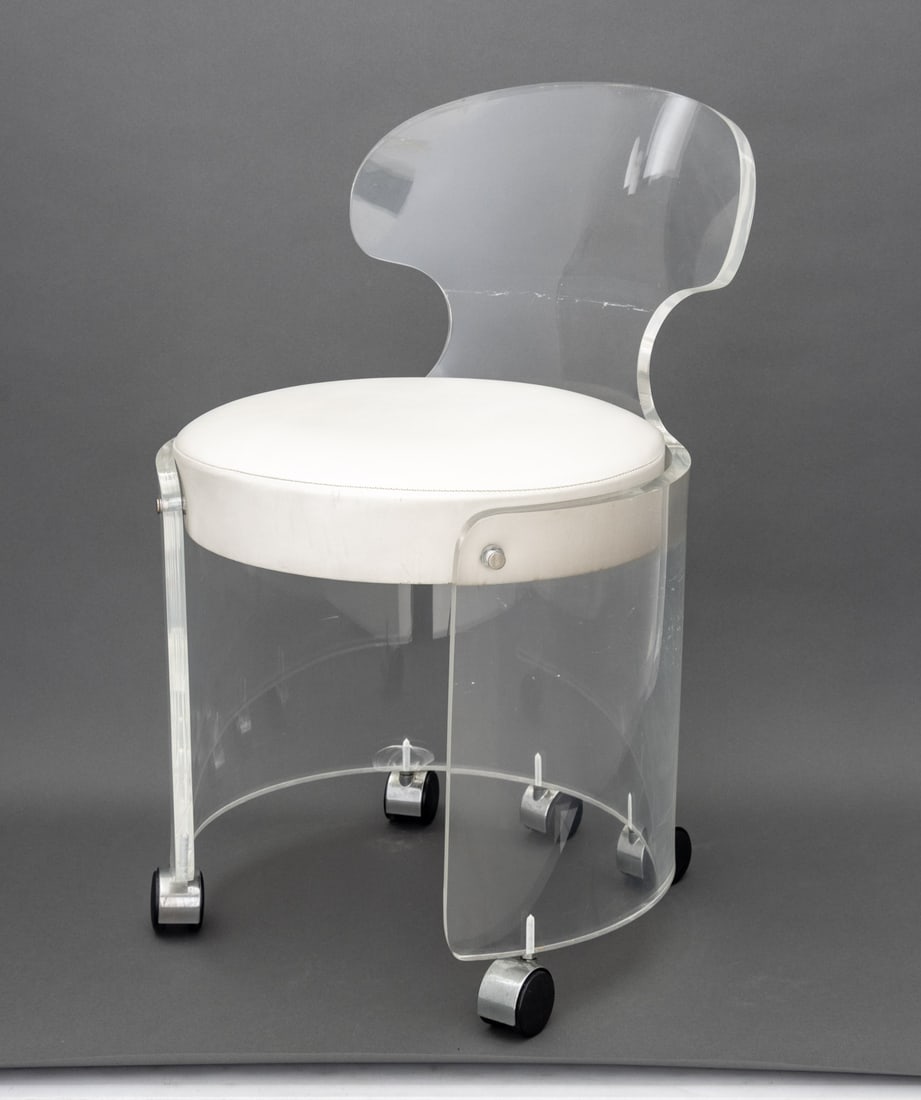 Philippe Starck Style Lucite Vanity Chair: Philippe Starck Style Lucite Vanity Chair, with white leather upholstered cushion on five casters. 26.25" H x 17" W x 18" D; seat: 16.5" H. Provenance: From a Long Island Estate. Keywords: Modern Furn