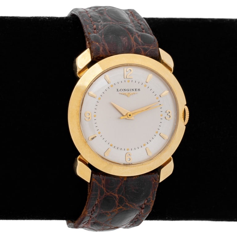 Longines 14K Yellow Gold Watch, 1950s: Longines 14K Yellow Gold Watch, 1950s, reference # APL - 30, with silvered dial, golden Arabic numeral and dagger indexes, powered by manual wind-up movement, calibre 22 - LS, worn on wrist with leath