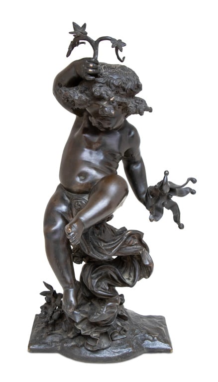 Auguste Moreau "Putto" Bronze Sculpture: After Auguste Moreau (French, 1834-1917) "Putto" Patinated Bronze Sculpture, the seated figure upholding a vine branch and a jester's rattle, seated on a draped rocky base, apparently unsigned. 22" H