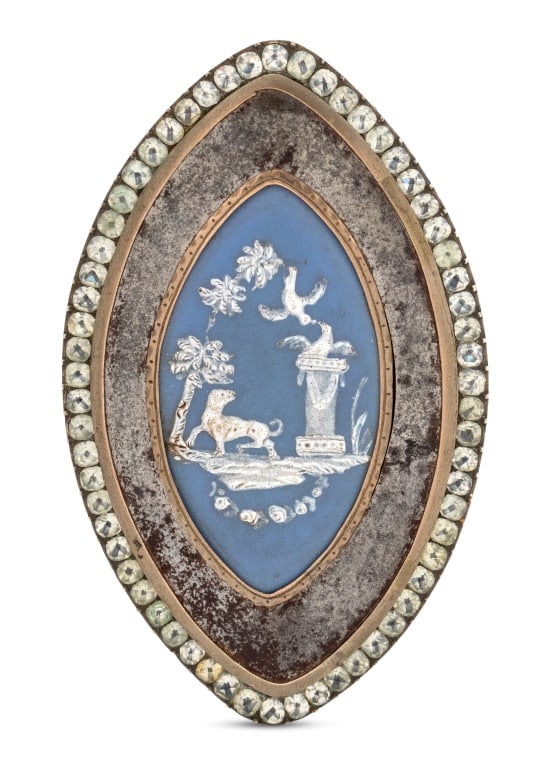 Georgian Gilt Steel & Porcelain Buckle, 18th C.: George III Period Gilt Steel and Porcelain Buckle, late 18th century, enameled porcelain-mounted steel and paste gem-set belt buckle, the navette shaped porcelain plaque with love birds threatened by 
