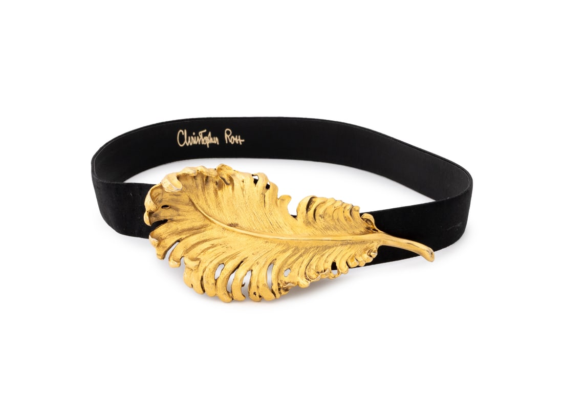 Christopher Ross Gold Plate Feather Belt, 1986: Christopher Ross Gold Plate Feather Form Belt Buckle and Black Silk Belt, 1986, signed and marked to reverse. 35.25" L x 3.5" W x 1.25" D. Provenance: Property from a Bunny Williams decorated 5th Aven