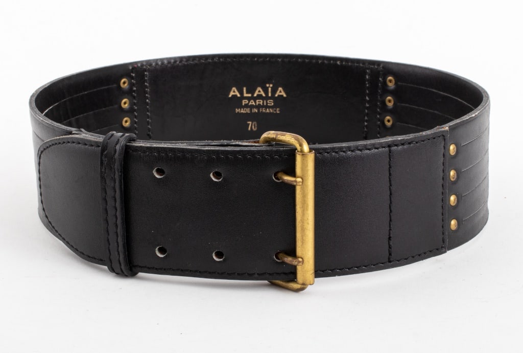 Alaia Black Leather Belt: Alaia Black Leather Belt, with brass hardware, size 70, marked "ALAIA / PARIS / MADE IN FRANCE / 70" to reverse. 31.5" L x 2.25" W. Provenance: From a Carlton House (21 East 61st Street) Estate. Keywo