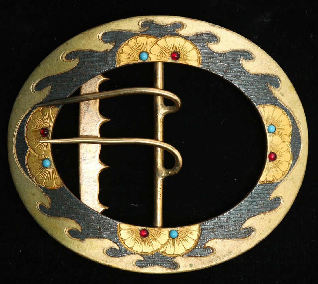 10K Gold Enamel Cabochon Mounted Belt Buckle: 10K Gold and Metal Enamel Cabochon Mounted Belt Buckle, oval form with Japanese-manner black enamel or niello, four faux turquoise and four faux ruby cabochons. 3.25" L. Gold tested and confirmed for