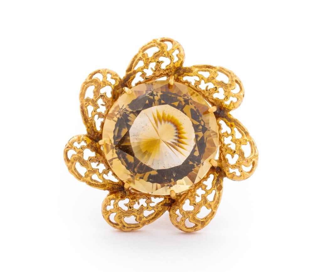 14K Yellow Gold Smoky Quartz Brooch: 14K Yellow Gold Smoky Quartz Brooch, designed as a floral frame with one centered prong set round brilliant cut smoky quartz weighing approx. 34.40 carats, worn through fabric with pinstem, joint and