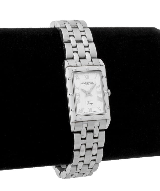 Raymond Weil Tango Stainless Steel Watch: Raymond Weil Tango Stainless Steel Watch, featuring white dial with silvered Roman numeral markers, battery powered quartz movement, worn on wrist with steel linked bracelet with double deployant clos