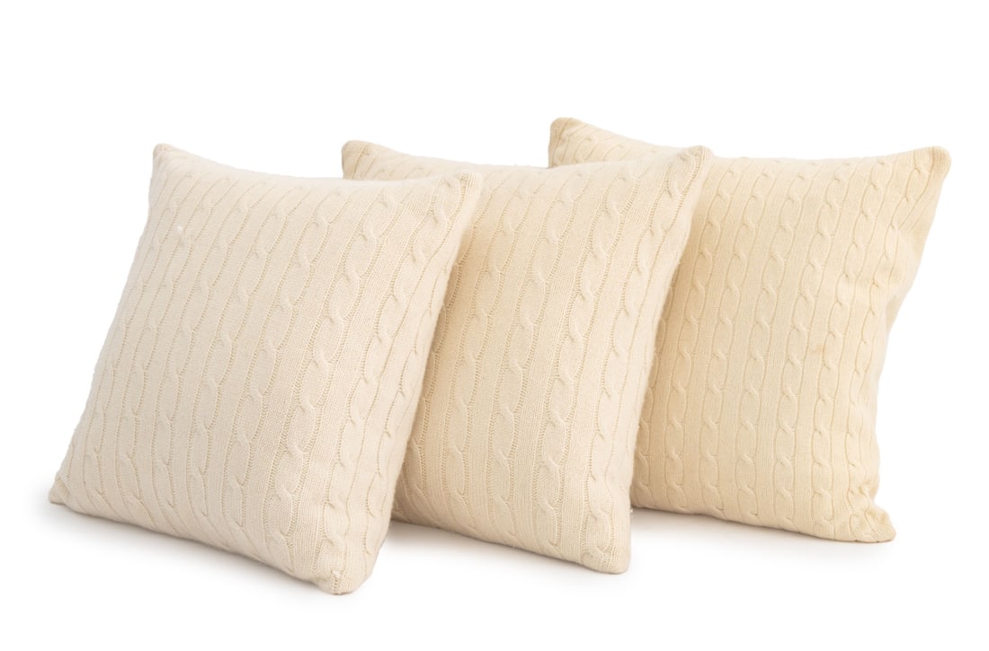 Ralph Lauren Cable-Knit Cashmere Pillows, 3: Collection of Three Ralph Lauren Beige Cable-Knit Cashmere Pillows, with "Ralph Lauren" labels. 19" H x 18" W x 6" D. Provenance: From a Long Island Estate. Keywords: Cushions, Throw pillows, Textiles