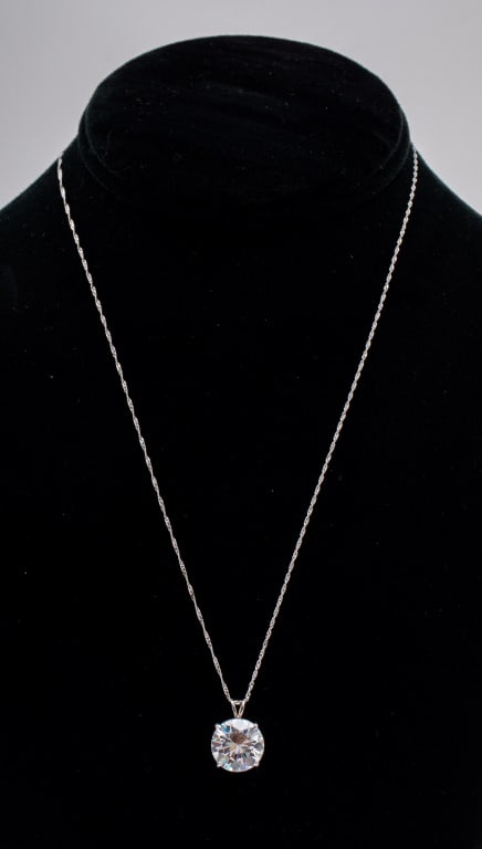 White Topaz 10K Gold Pendant on 14K Necklace: 5.70 Carats Round Brilliant-Cut White Topaz Solitaire 10K White Gold Pendant on 14K White Gold Singapore Style Chain Necklace, marked: "14K / F / 14K". Pendant: 0.5" L x 0.5" W x 0.31" H on 18.12" L x