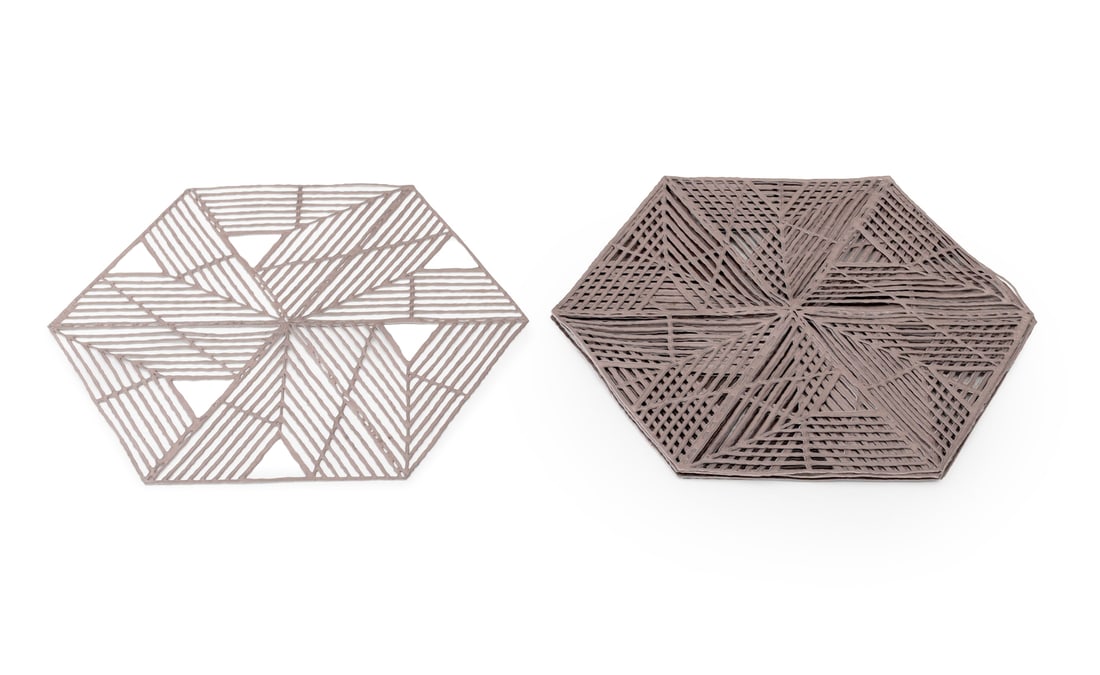 Chilewich Metallic Hexagonal Placemats, 8: Set of Eight Chilewich Gunmetal-Tone Metallic Rubber Reticulated Hexagonal Placemats, each marked. 16.25" L x 14" W. Provenance: From a Long Island Estate. Keywords: Designer, Tableware, Place setting