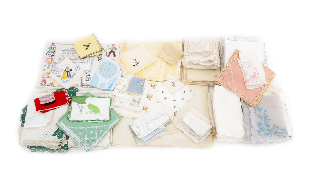 Collection of Embroidered Table Linens: Collection of Embroidered Table Linens, including tablecloth, napkins, table runners, and handkerchiefs. Largest: 58" L x 81" W. Provenance: From a New York City Collection. Keywords: Textiles, Embroi