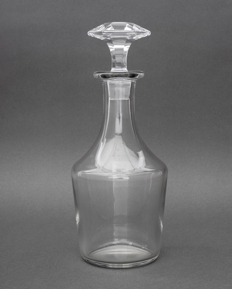 Baccarat Crystal Decanter: Baccarat Crystal Decanter, with faceted stopper, faint mark to underside. 11.25" H x 4.5" Diameter. Provenance: From a New York City Collection. Keywords: French cristal, France, Luxury brand, Tablewa