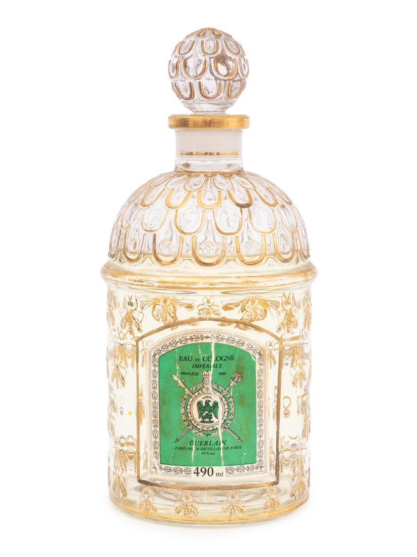 Guerlain Eau de Cologne Imperiale Perfume Factice: Guerlain Eau de Cologne Imperiale Perfume Factice, bee motif embossed and gilt decorated bottle, marked "Guerlain / Made in France" to underside. 7.5" H x 3.5" Diameter. Provenance: From the Collectio