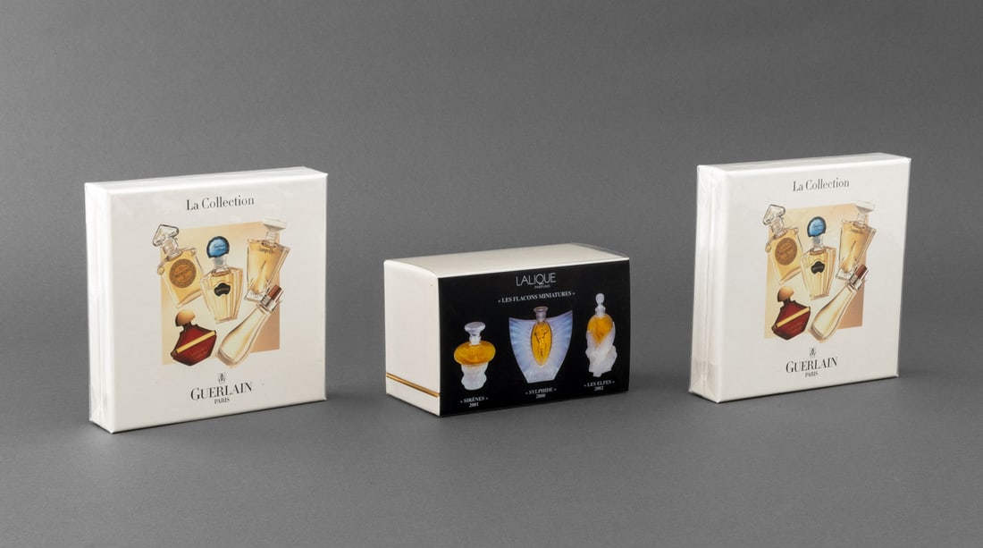 French Perfume Miniature Sampler Sets, 3: Group of Three French Perfume Miniature Sampler Sets, comprising: two Guerlain Paris "La Collection" sets with Coriolan, Shalimar, Samsara, Mitsouko, and Champs-Elysees, and Lalique "Les Flacons Minia
