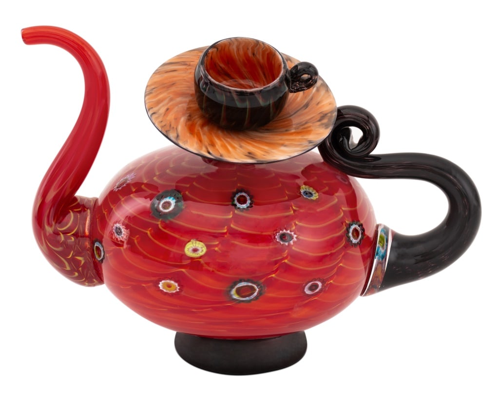 Christian Thirion Art Glass Teapot Sculpture: Christian Thirion (French, b. 1941) Art Glass Teapot Sculpture, surmounted by balancing teacup and saucer, signed under handle. 7.75" H x 11" W x 6.5" D. Provenance: From a multi-generation 5th Avenue