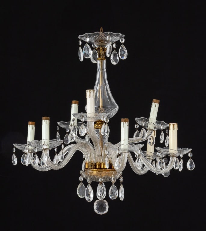 Italian Crystal 9-Branch Chandelier: Italian Crystal Nine-Branch Chandelier, with scroll-arms having faceted prism teardrop crystal pendants. 24" H x 24" W x 24" D. Provenance: From a New York City Collection. Keywords: Vintage Lighting,