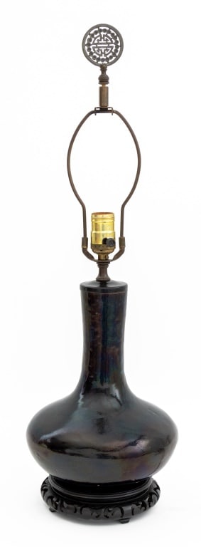 Chinese Mirror Black Glazed Porcelain Vase as Lamp: Chinese Mirror Black Glazed Porcelain Bottle Vase Mounted as a Table Lamp, 20th century, atop pierced wood base. 25.25" H x 9.25" Diameter. Provenance: From a 35 East 75th Street Estate. Keywords: Lig