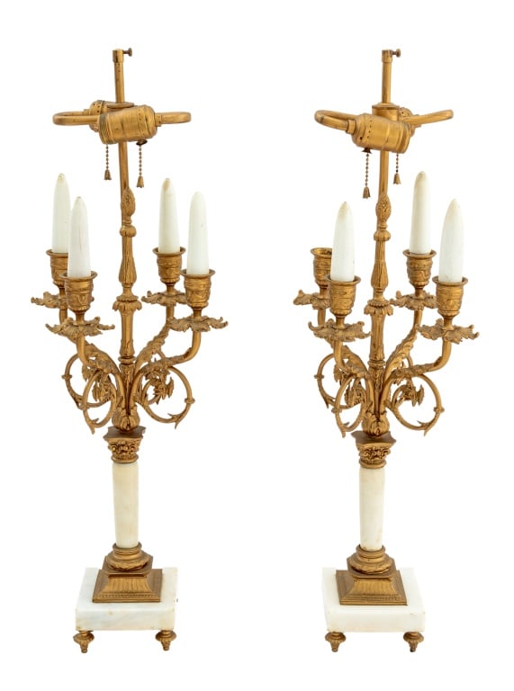 French Gilt Brass and White Marble Lamps, Pair: Pair of French Four Light Gilt Brass and White Marble Lamps, circa 1900, having four scroll arms with chicken portrait motif above marble and gilt brass Corinthian column mounted on square marble base