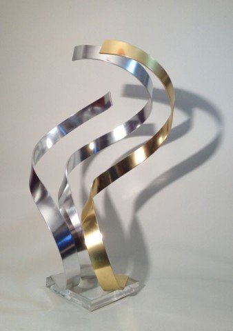 Dan Murphy Anodized Aluminum Ribbon Sculpture: Rhythmic abstract sculpture of three ribbons, two of anodized aluminum and one of brass-toned anodized aluminum, on lucite base; inscribed "Dan Murphy 1983." Dimensions: 24"H x 14"W x 14"D