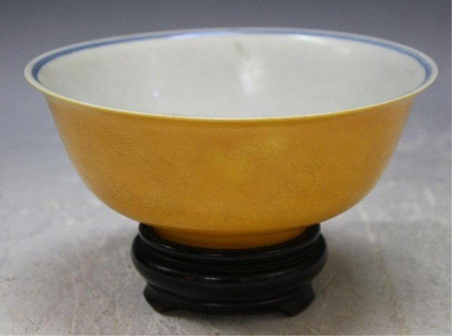 Chinese Late Qing Dynasty Bowl w/ Stand: From the "Kuang-Hsu" region, mustard colored bowl with blue fish design inside, China, Qing Dynasty (1644-1911); Kuang-Hsu Huangxu mark Dimensions: bowl 2-1/2" H x 6" diameter, stand 3-1/4" H x 3" dia