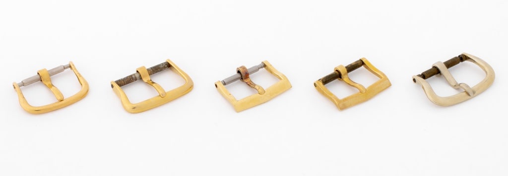 Elgin, Longines, Etc. Gold Loose Watch Buckles, 5: Collection of Five Gold Loose Watch Buckles, comprising: (2) two Elgin 14K yellow gold, marked, (1) one Longines 14K yellow gold, marked, (1) one Movado 14K yellow gold, marked, and (1) one 18K white