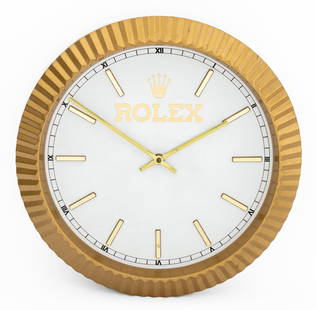 Rolex Gold-Tone Painted Resin Wall Clock: Rolex Genuine Gold-Tone Painted Resin Wall Clock, with Keinzle Quartz battery operated mechanism and gilt metal baton indices and clock hands. 14.25" Diameter x 2.5" D. Provenance: From a New York Cit