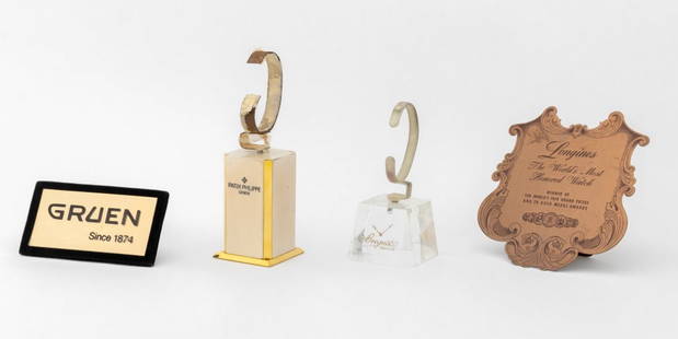 Patek Philippe, Etc. Watch Display Articles, 4: Collection of Four Designer Watch Display Articles, comprising: Longines "Ten Worlds Fair" copper plaque commemorating ten grand prize wins, Gruen black velvet and gold-tone metal plaque, Breguet watc