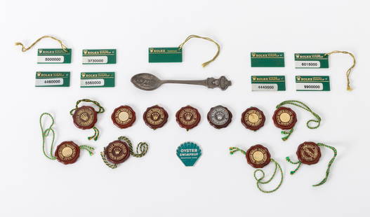 Rolex Memorabilia, 23 Pcs.: Collection of 23 Pieces of Rolex Genuine Memorabilia, comprising: (11) burgundy resin "Rolex Watch Co. Ltd / Geneva-Bienne" tags, (9) nine green resin "Rolex / Oyser Swimpruf" and "Oysterlock" tags, (